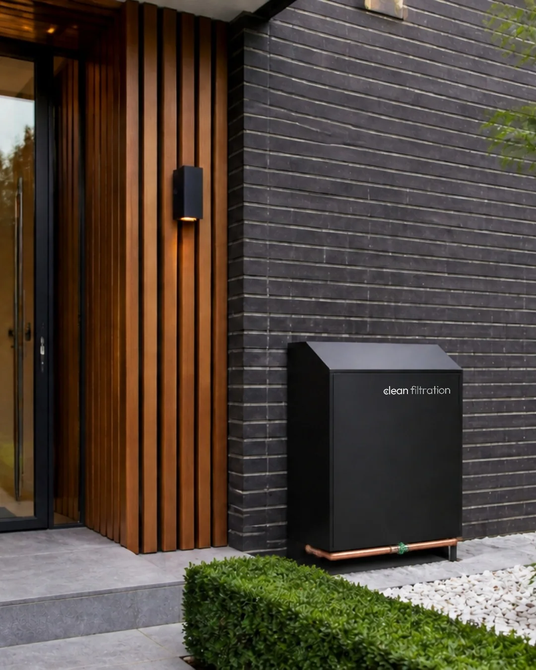 Example install plan mockup: Clean Filtration cover beside a brick facade (concept image)